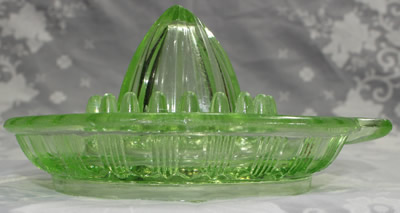 The end view of a Crown Crystal Glass Type 1 amber glass juicer