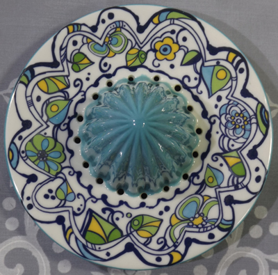 Stylised flowers on aqua and white reamer