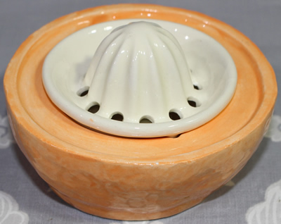 Open view of NRCA 2001 orange ceramic juicer