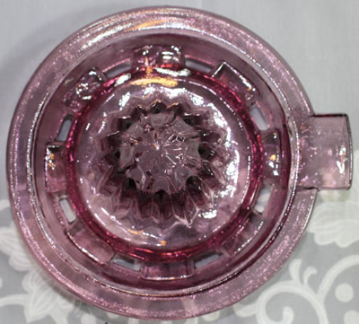 The reamer for a mauve reproduction 2 piece glass juicer