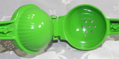 An open green powder coated aluminium squeezer