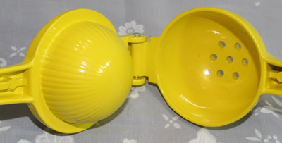 An open yellow powder coated aluminium squeezer