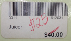 Barcode label on beige Australian pottery saucer juicer
