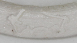 Buffalo potter's mark on white Australian pottery saucer juicer