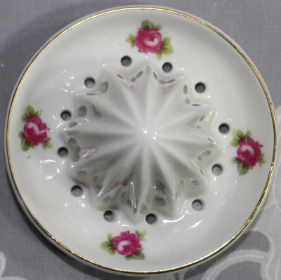 The reamer for a fruit on white with gold trim Prussian 2 piece juicer