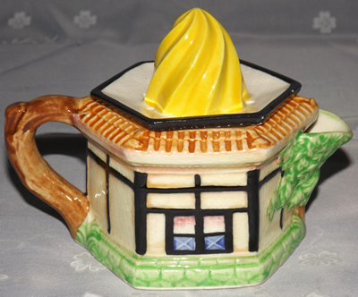Back view of a yellow spiral top hexagonal cottage juicer