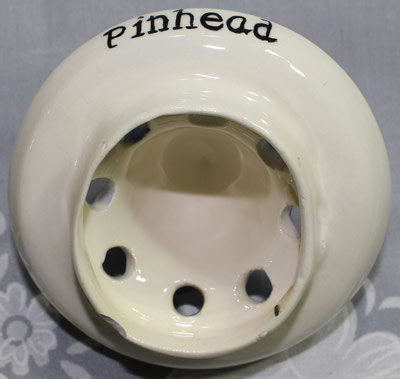 The bottom of the reamer for a Pinhead with blue hat juicer