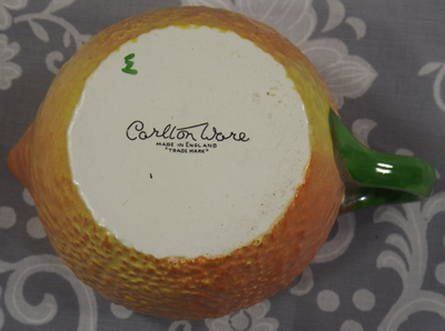 Basemark on an unusual shades of orange lustre Carlton Ware juicer jug