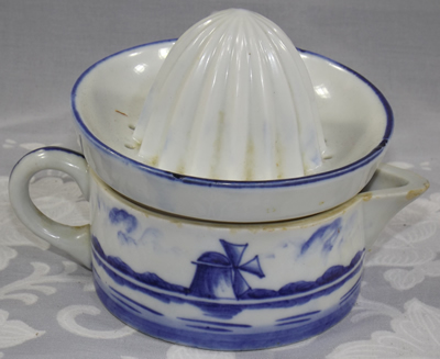 The back of a boat 'type 4' and windmill on 2 piece blue & white juicer
