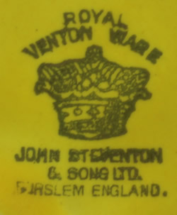 Left hand face of green U.S.Glass Co. tear drop handle juicer