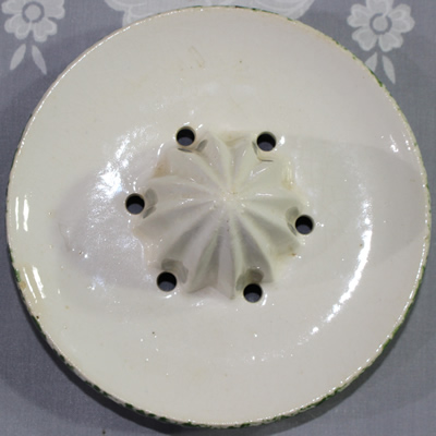 The reamer for a fruit on green trim white ceramic jug juicer