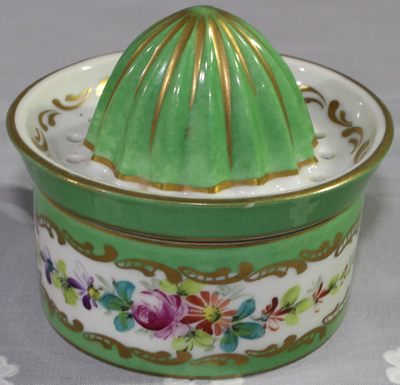 Back of green on white with gold trim 2 piece juicer