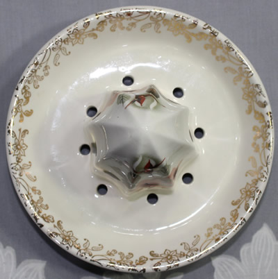 The reamer for a pink and white roses on a Lord Nelson Pottery juicer
