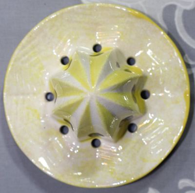 The reamer for a pink and blue base collar clown juicer