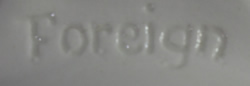 Impressed "Foreign" on white German ceramic strainer juicer
