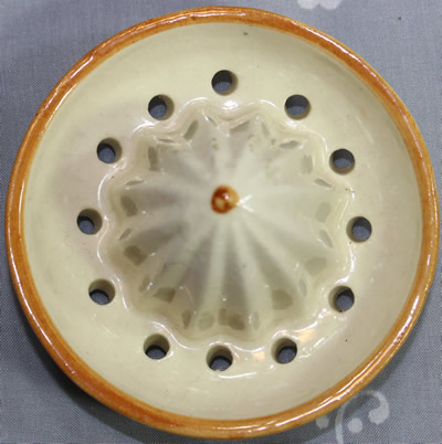 The reamer for a blue flowers on yellow Maruhon Ware ceramic juicer