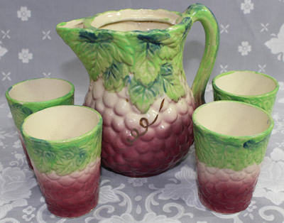 The set of pink with green leaves juicer and tumblers
