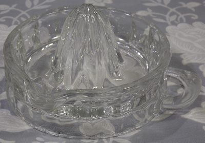 Silver rimmed clear glass juicer without rim