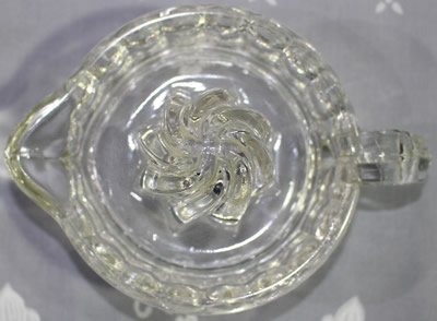 U.S. Glass Company clear glass juicer with spiral reamer top view