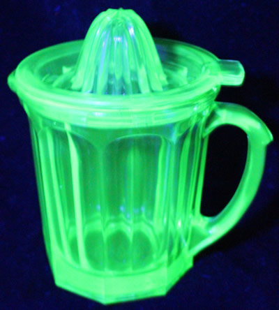 Hazel Atlas Glass Co. green A&J jug juicer under UV light