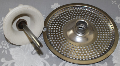 The seperated reamer and strainer insert for a white milk glass juicer attachment