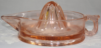 Side view of a large pink Cambridge Glass Co. juicer