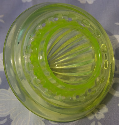 Bottom of reamer for yellow Uranium Gillespie Measuring Cup with a reamer top juicer