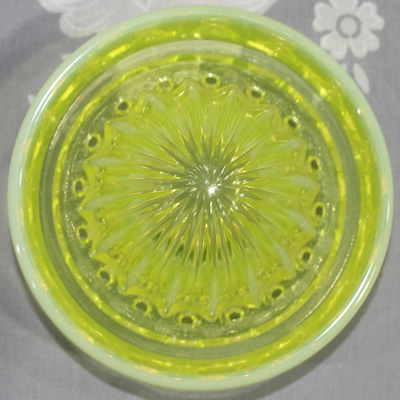 Reamer for a frosted yellow uranium Gillespie Measuring Cup with a reamer top juicer