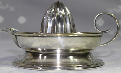 Side view silver plate cup juicer
