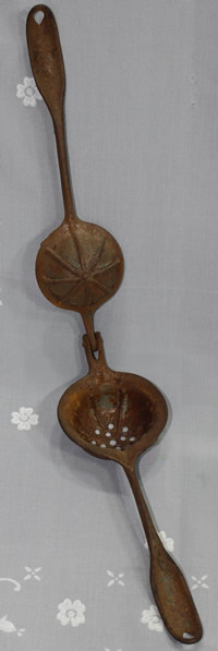 An open PAT. NOV.24.85 steel juicer