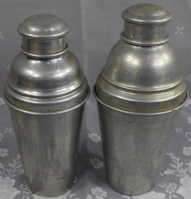 2 sizes of very similar cocktail shakers with juicers.