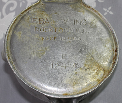 Inscribed basee of large aluminium Ebaloy  hinged 2 piece juicer