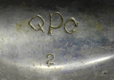 The inscribed base of an aluminium 3 piece squeezer juicer with pouring spout