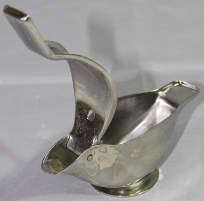 An open Japanese stainless steel bird wedge juicer