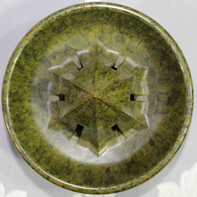 Top view of Jubilee mottled green Bakelite juicer for glass jar