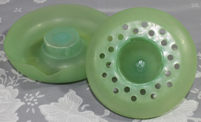 The 2 parts of an Australian green plastic 2 piece juicer