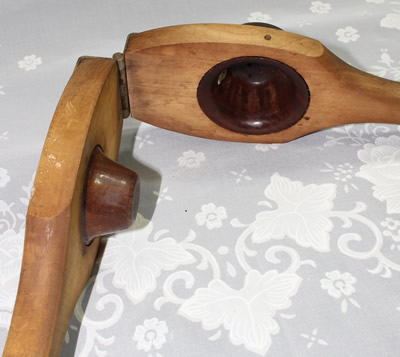 The of bowl and press of a hinged 'Lignum Vitae' hand held squeezer
