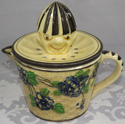 Blue flowers on a basket weave jug clown juicer