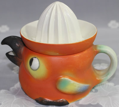 L.G. Co. Germany orange with black beak chick juicer