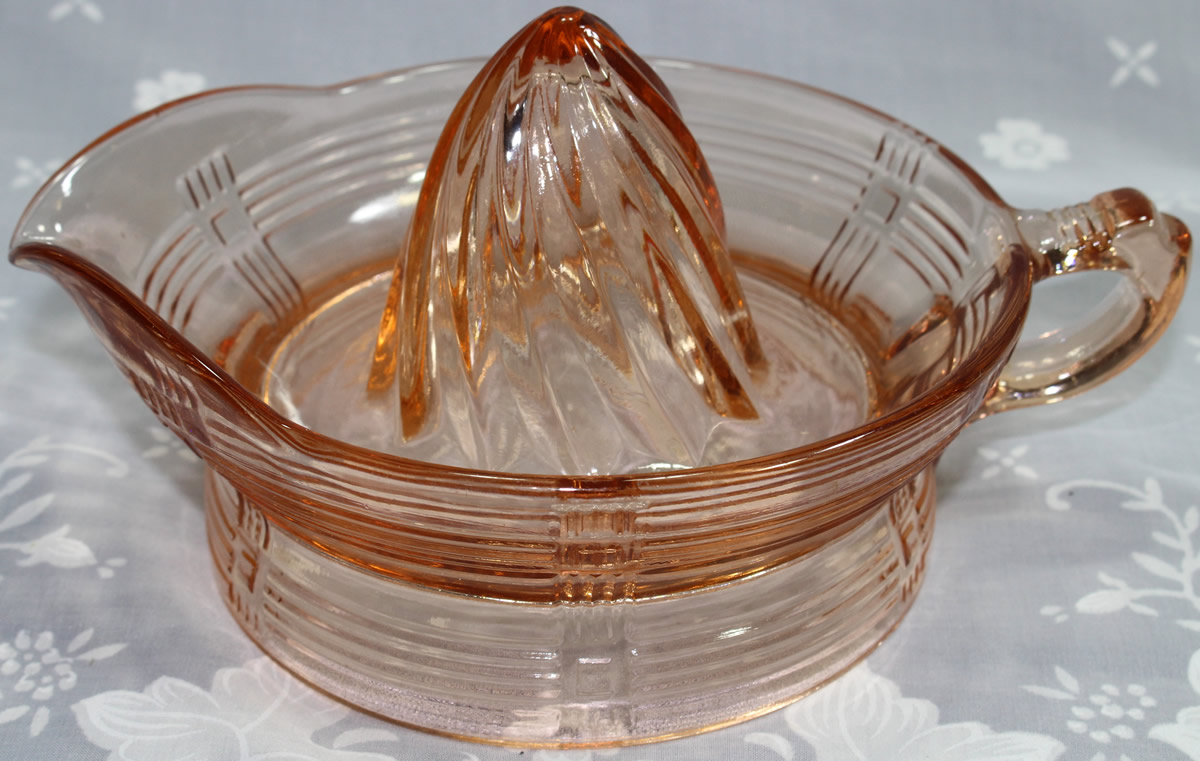 Large orange pink Hazel Atlas criss-cross juicer