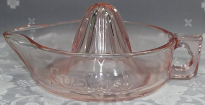 Pale pink glass Sunkist juicer