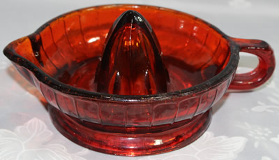 Modern ruby red glass juicer